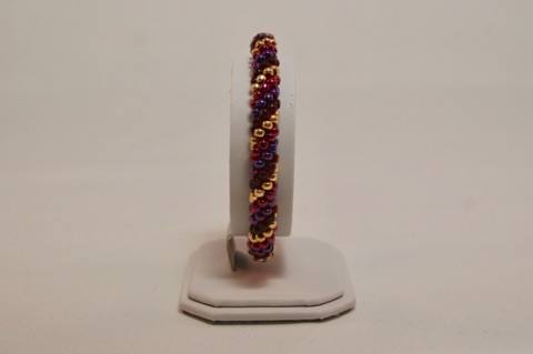 Reds, Purple, and Gold Spiral Beaded Kumihimo Bracelet